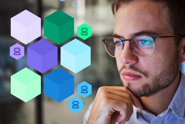 Man in glasses thinking and looking at a diagram of hexagons