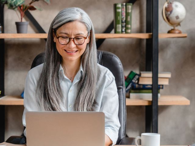 Finance executive using computer in office