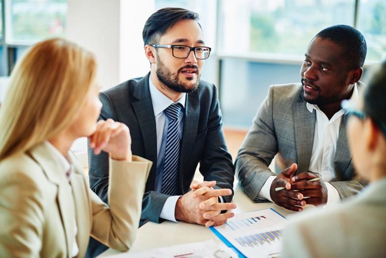 two men and two women having a meeting