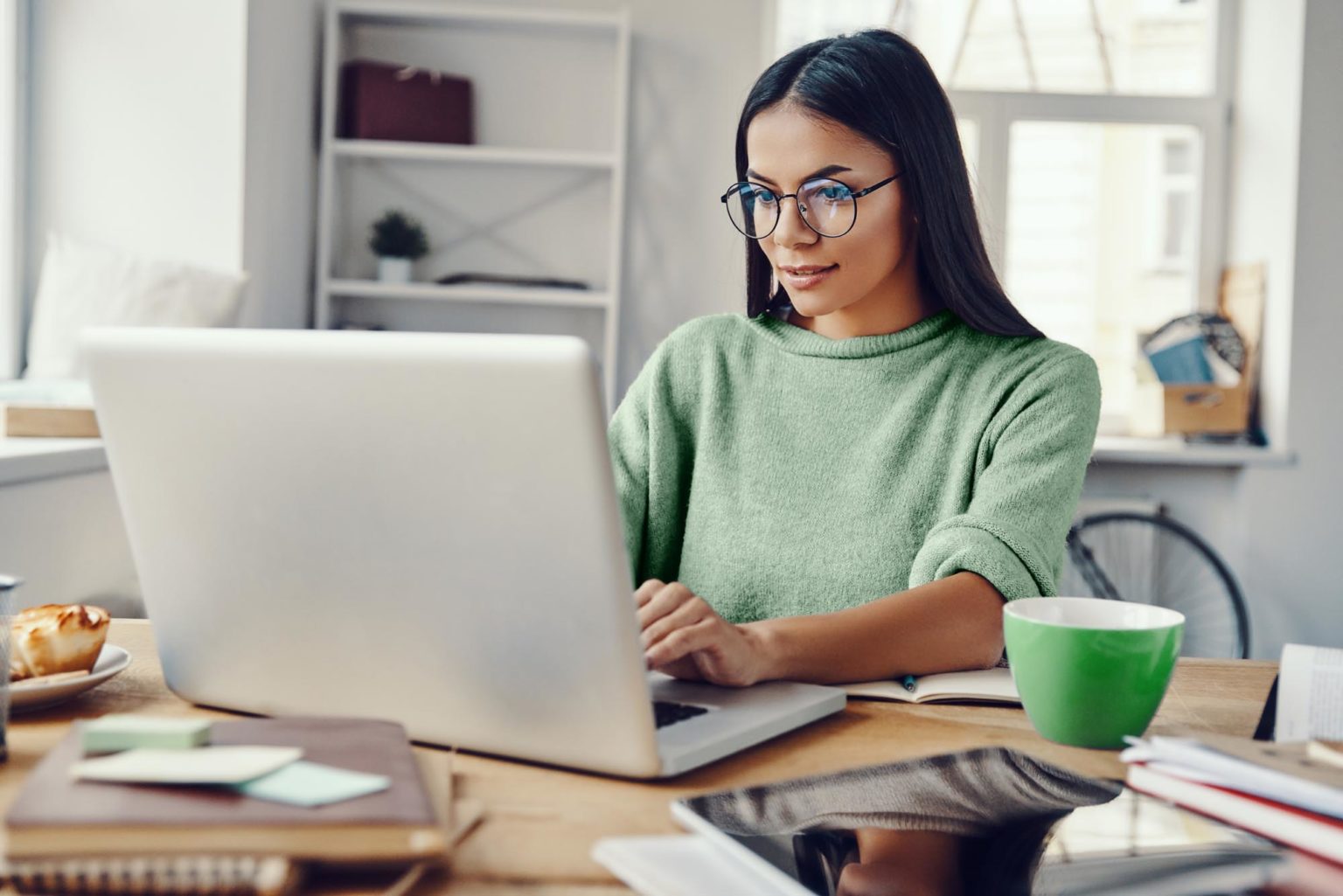 woman in her home office working on her laptop