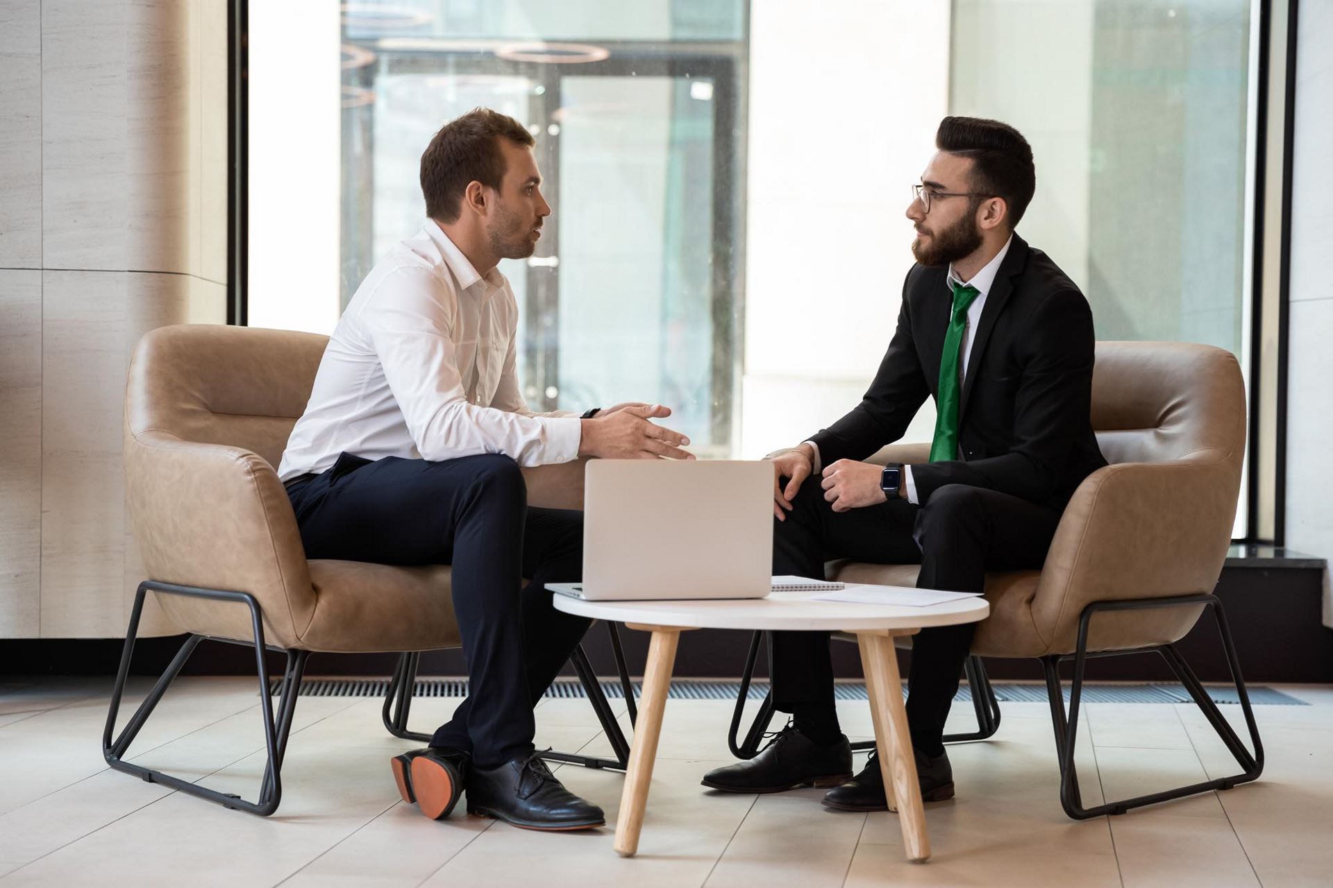 two men in an office environment having a conversation