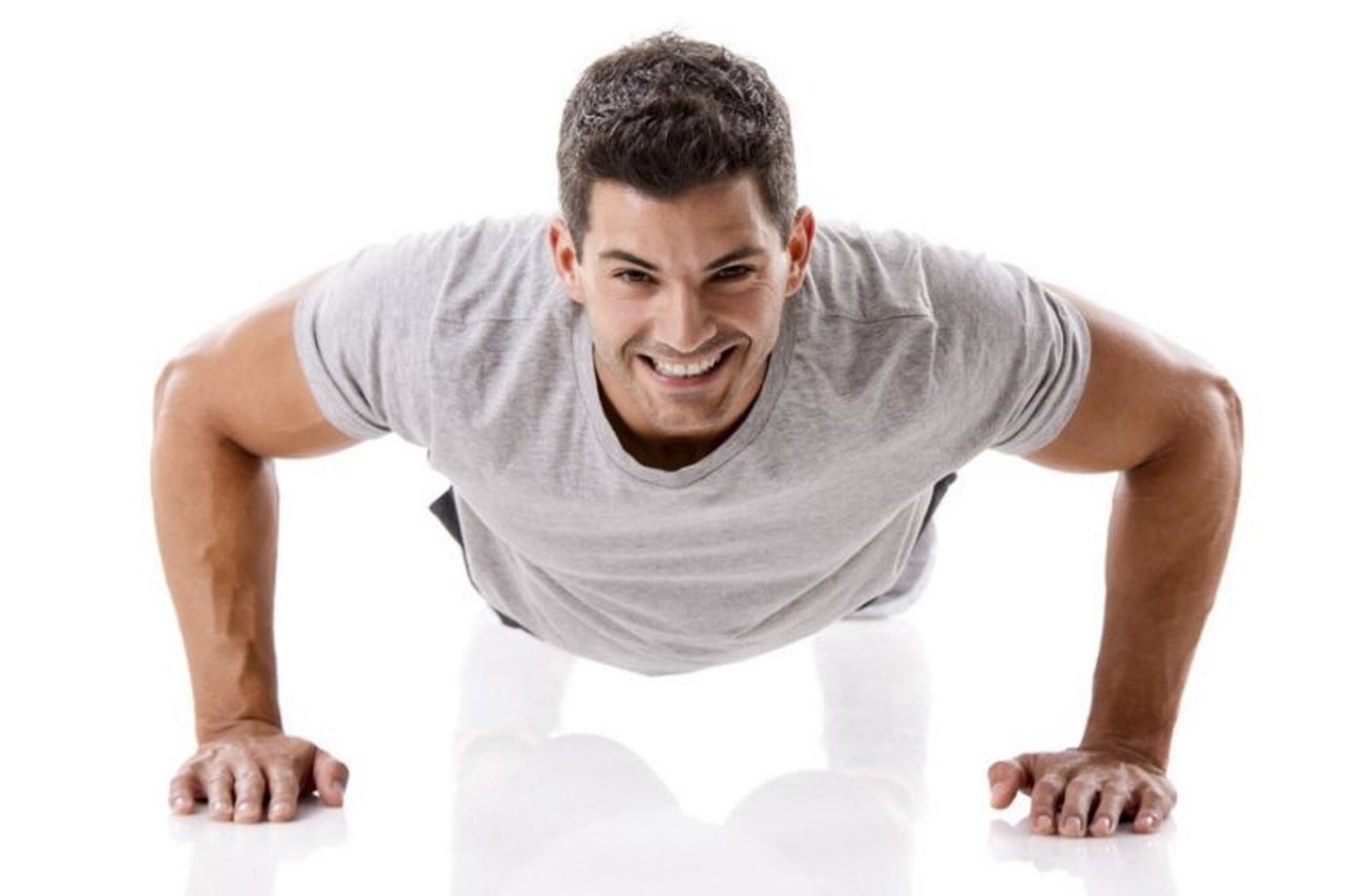 Man doing pushups with white shirt