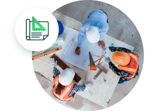 Workers standing at table looking at construction plans