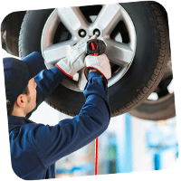 Mechanic maintaining car tire